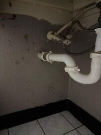 Walls underneath bathroom sink.
