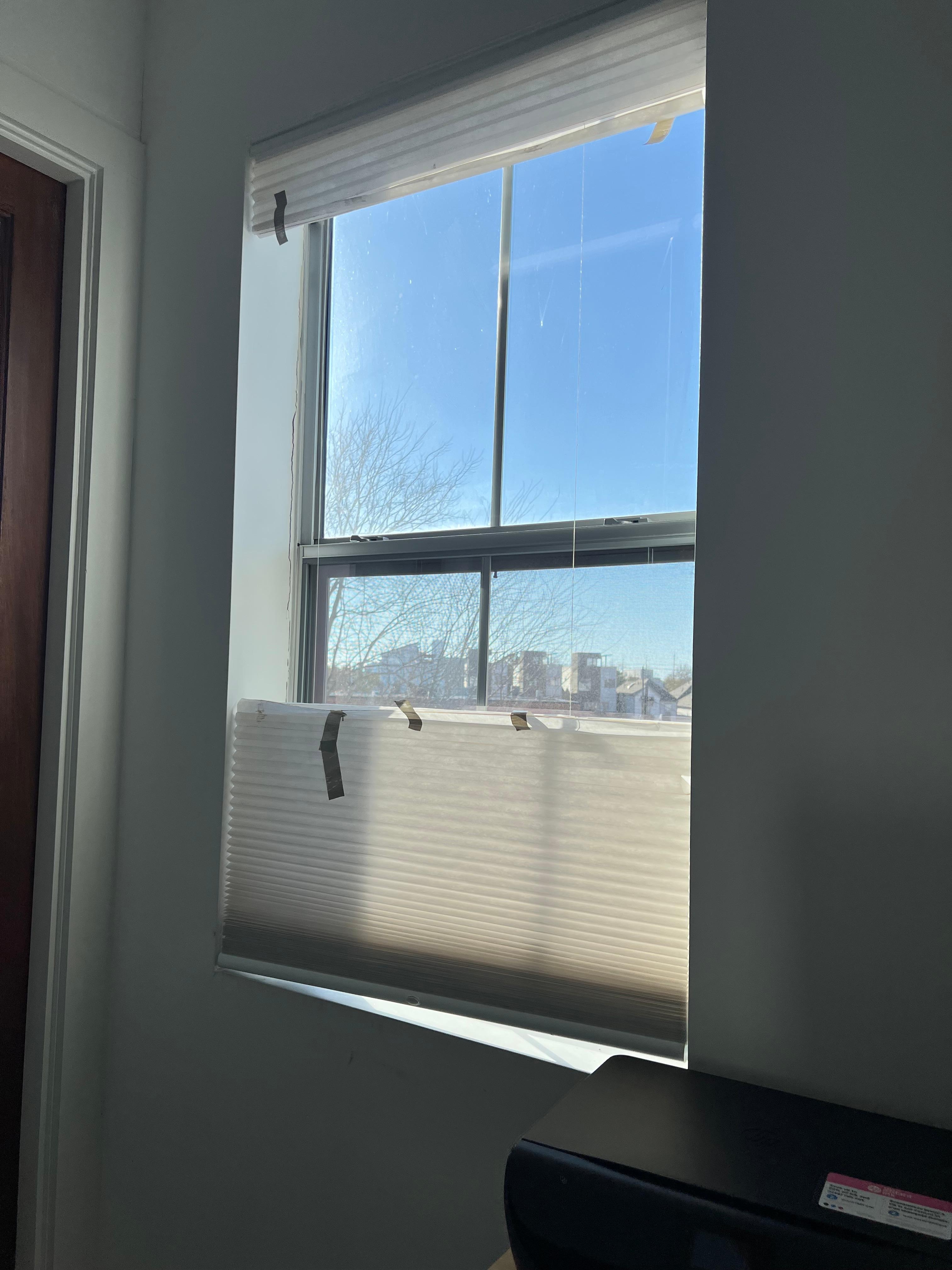 Blinds “held” together with duct tape 