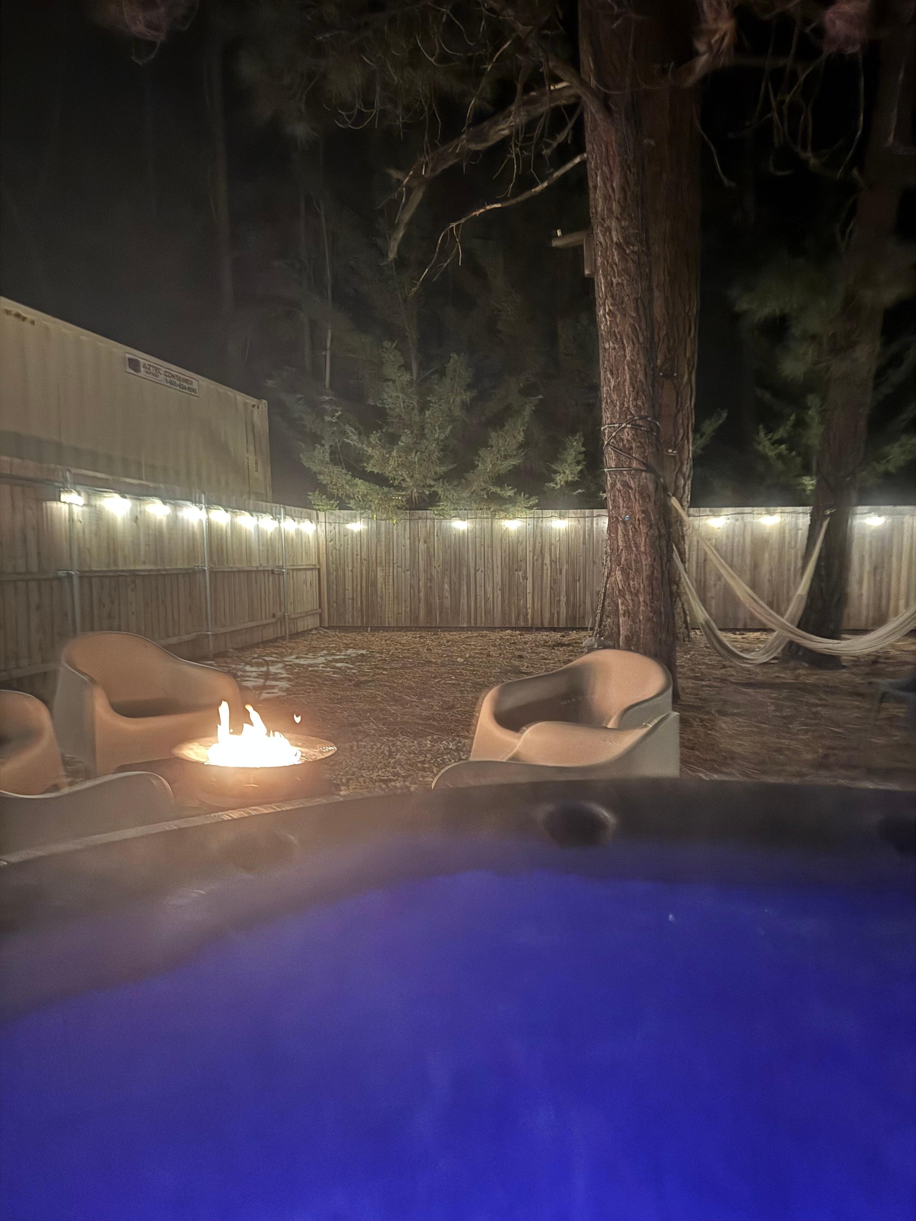 Our private backyard with beautiful redwoods and a jacuzzi.