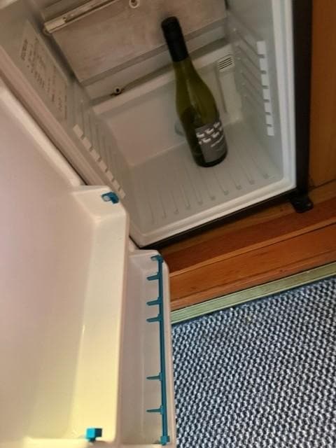 Inside of the battel worn room fridge.