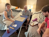 Playing scrabble in our room while the kids play in the pool