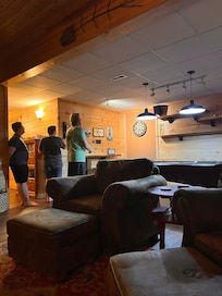 Game area, darts and pool.