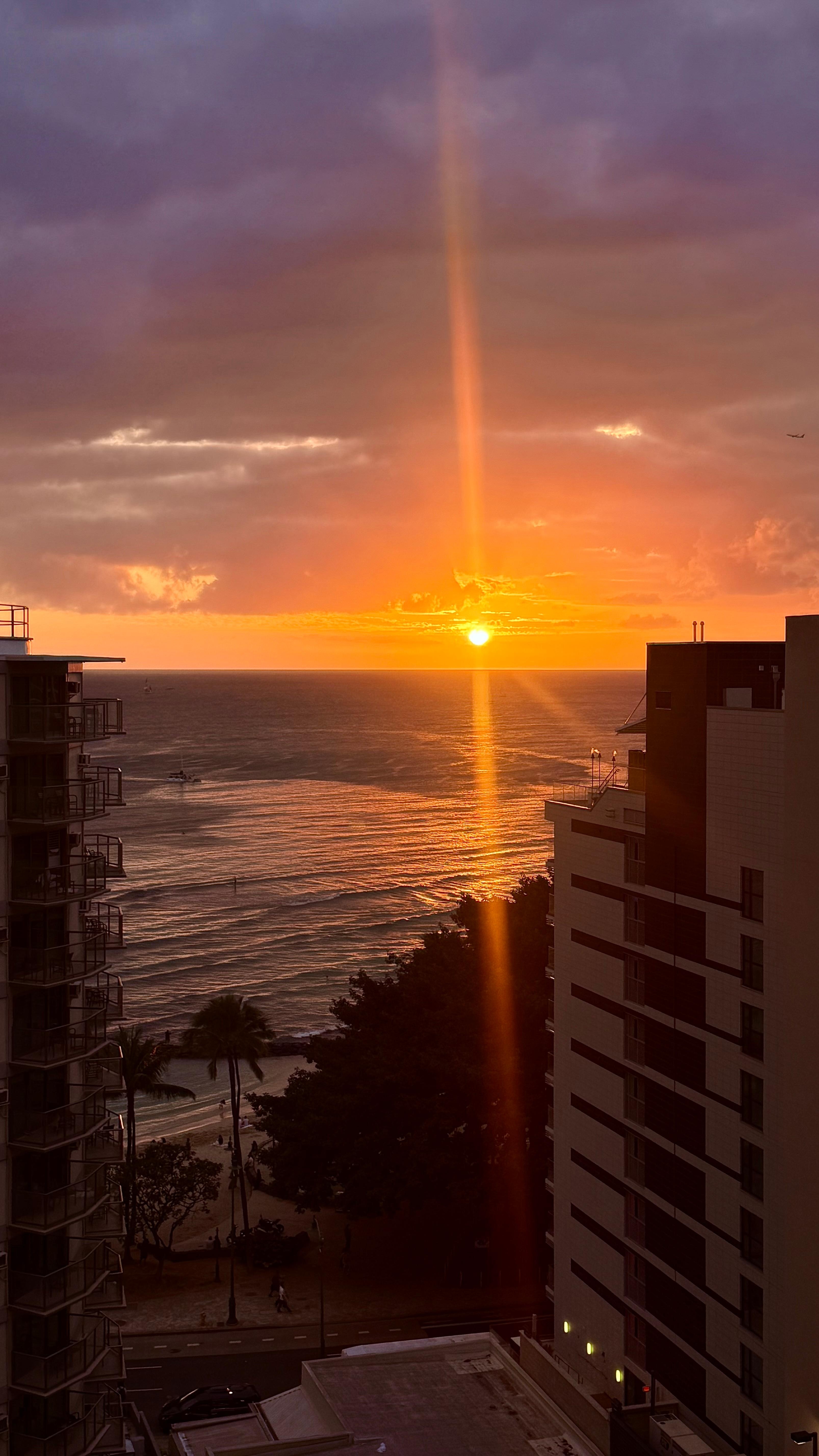 Sunset over Waikiki beach view from our balcony.