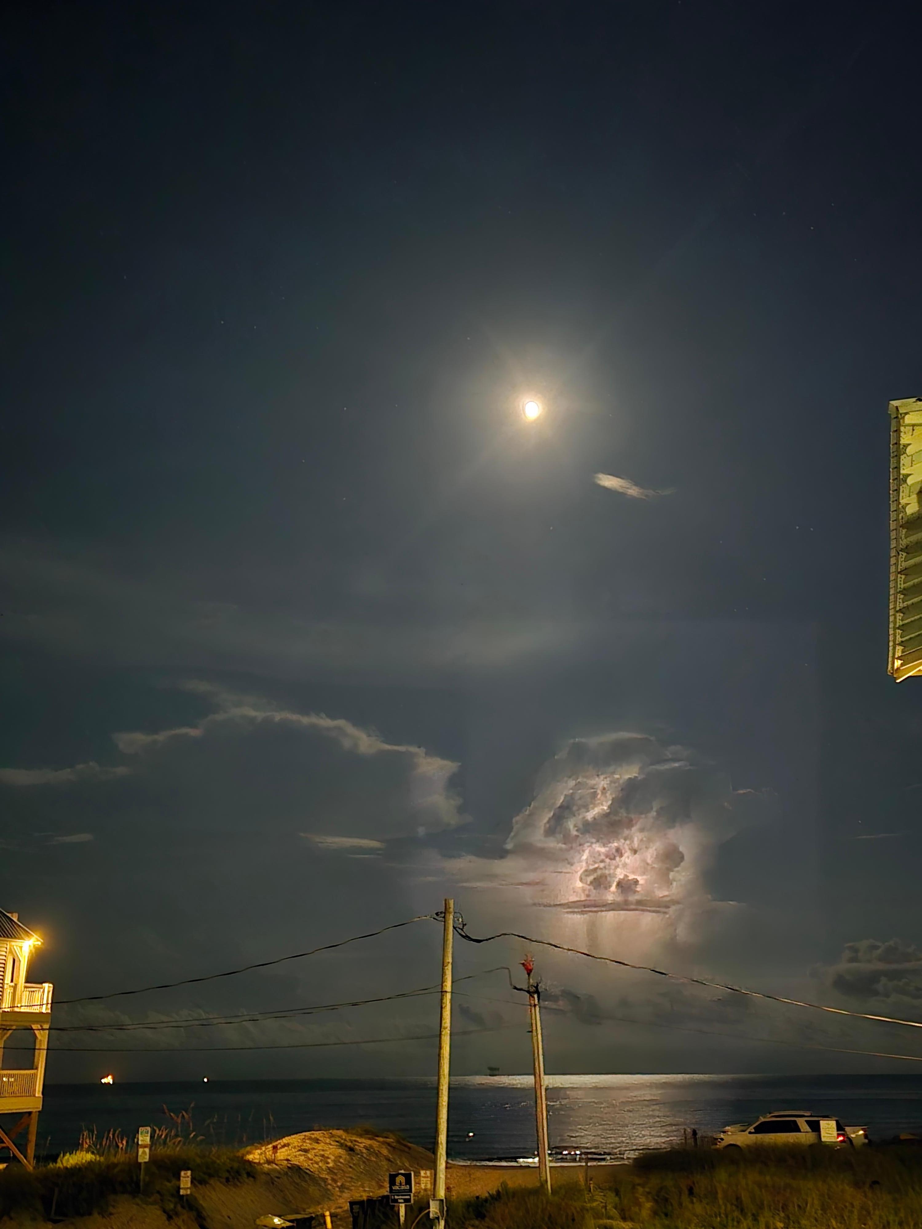 Off the deck looking straight towards the Gulf at night. Lightning action in the background.