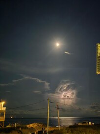 Off the deck looking straight towards the Gulf at night. Lightning action in the background.
