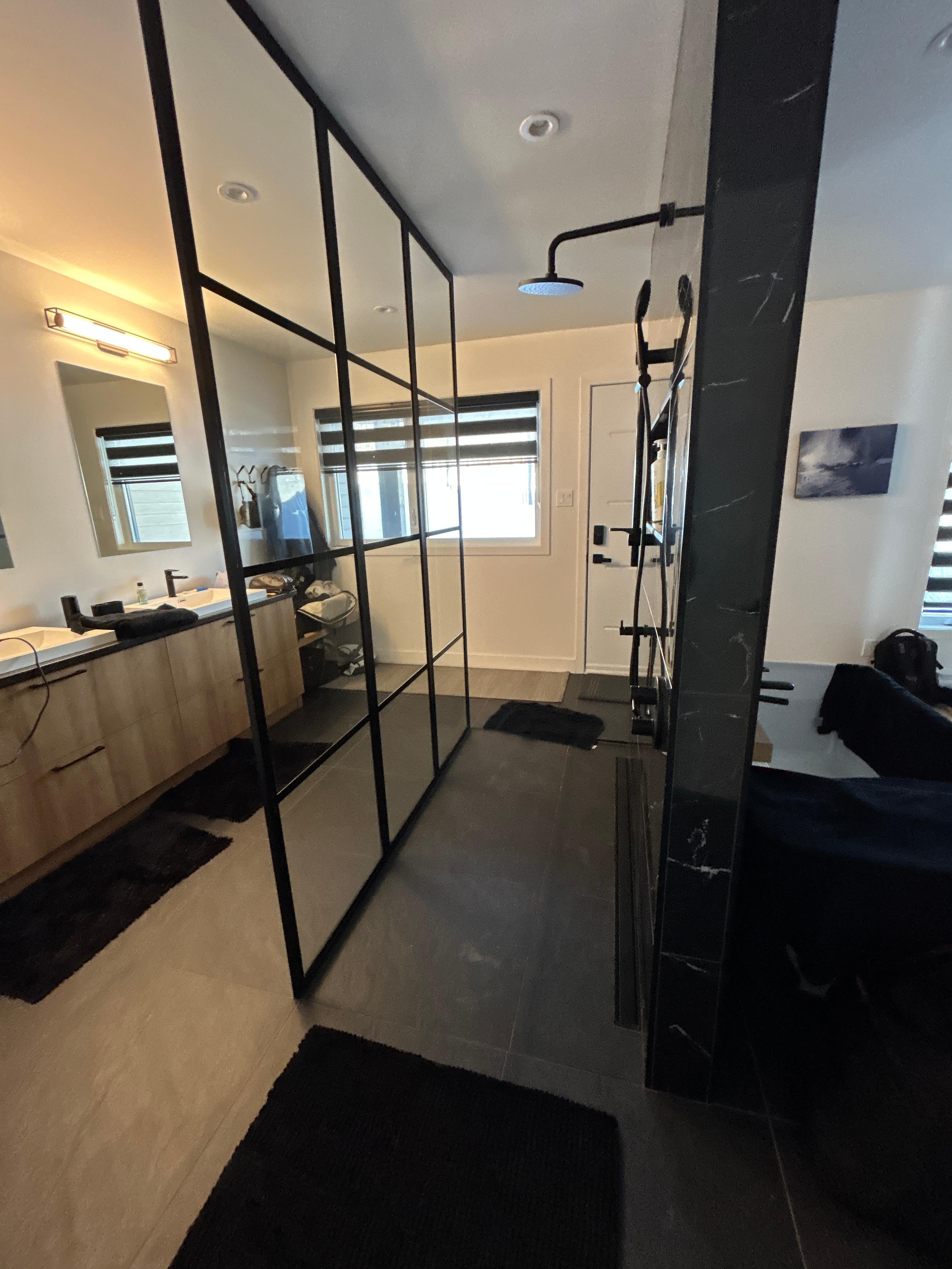 Downstairs master suite sower, plus door to hot tub & gondola