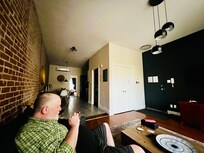 Sitting on the couch using the string Wi-Fi signal.