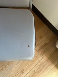 A cigarette burn in the desk chair