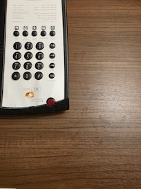 The nightstand had water marks from cup that was left there.