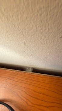 Dust behind the bed