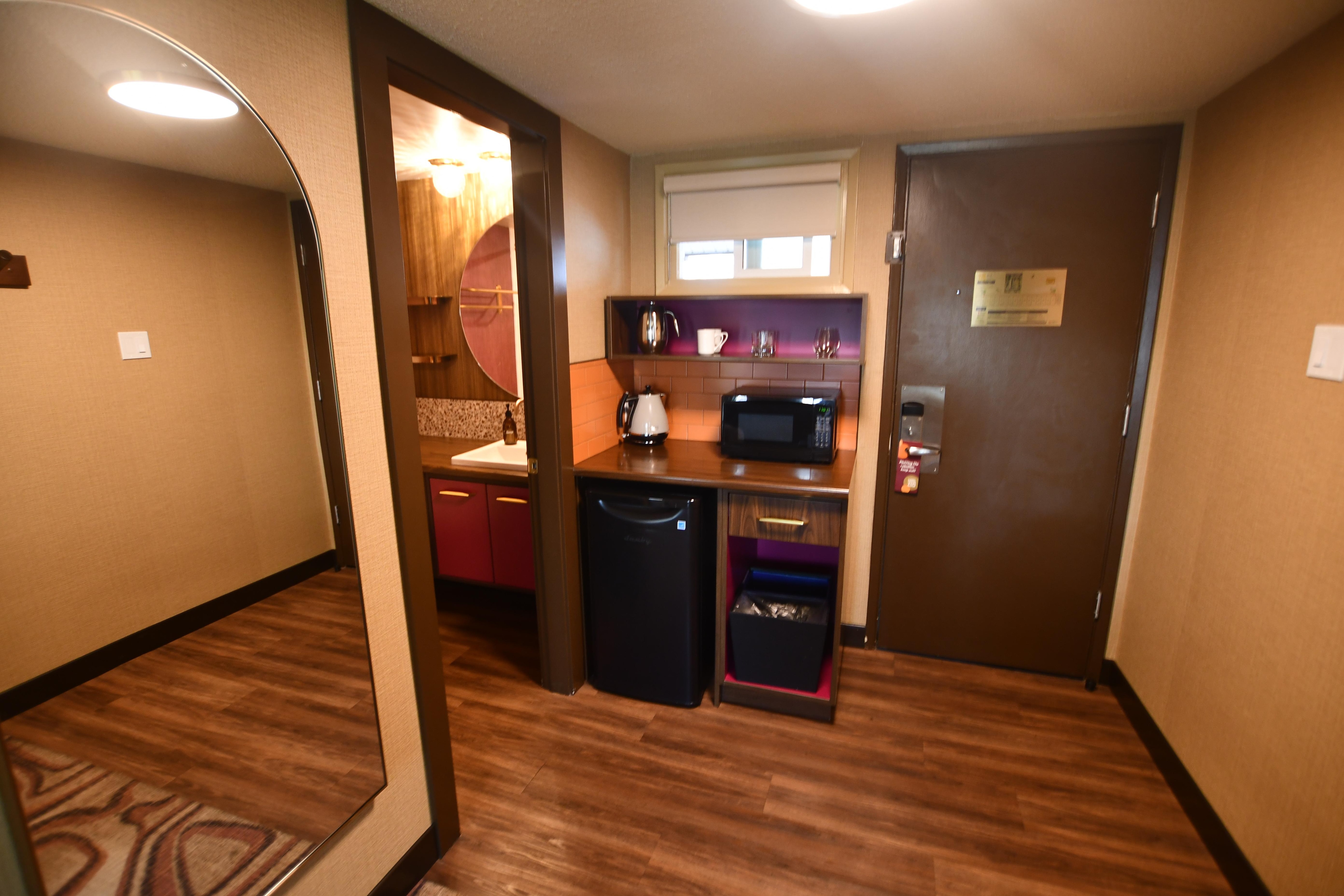 Note the fridge and very large mirror