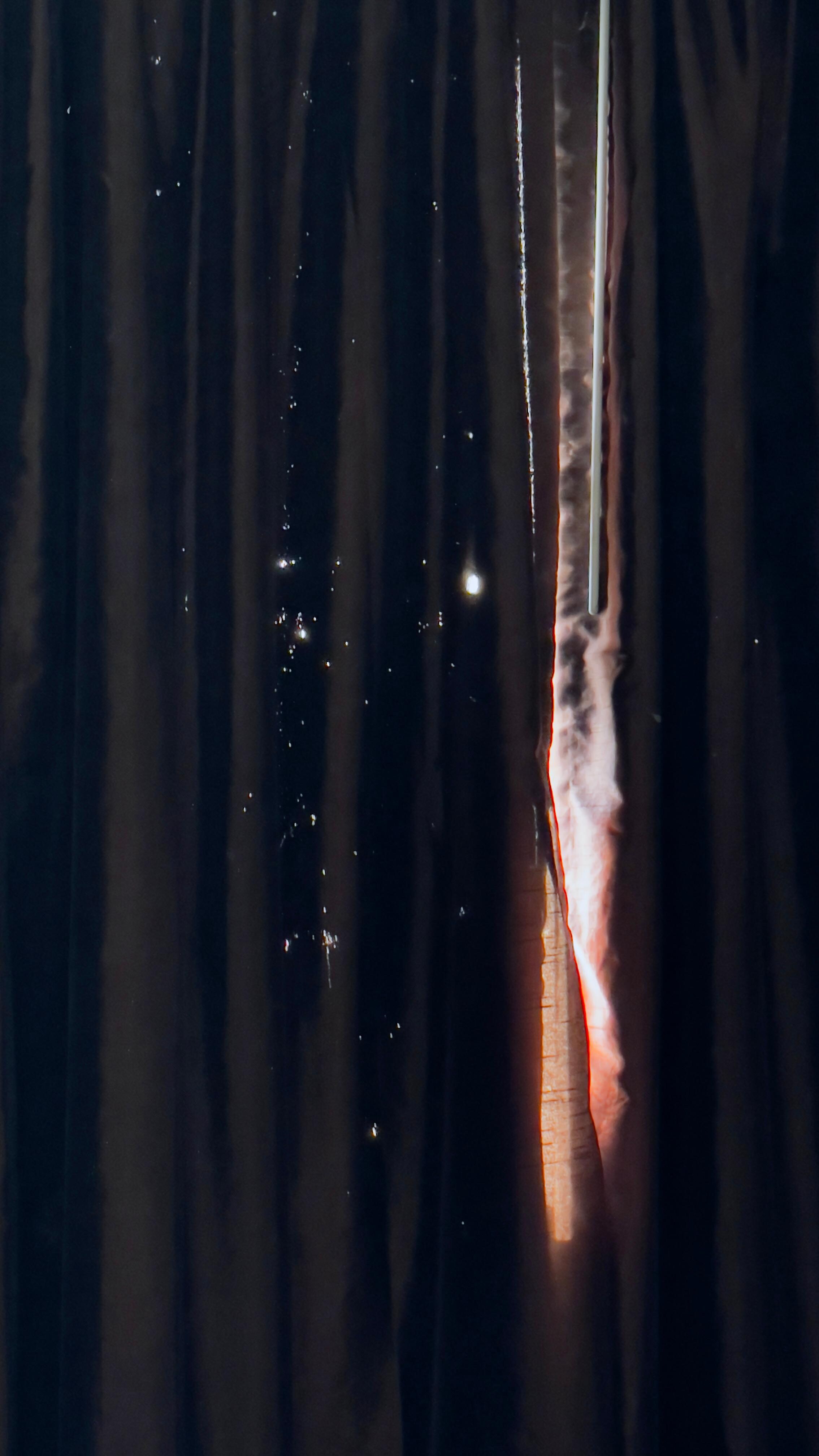 The curtain had burn holes where the light shines thru
