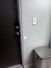 This is the cracked paint and bubbling wall by the front door