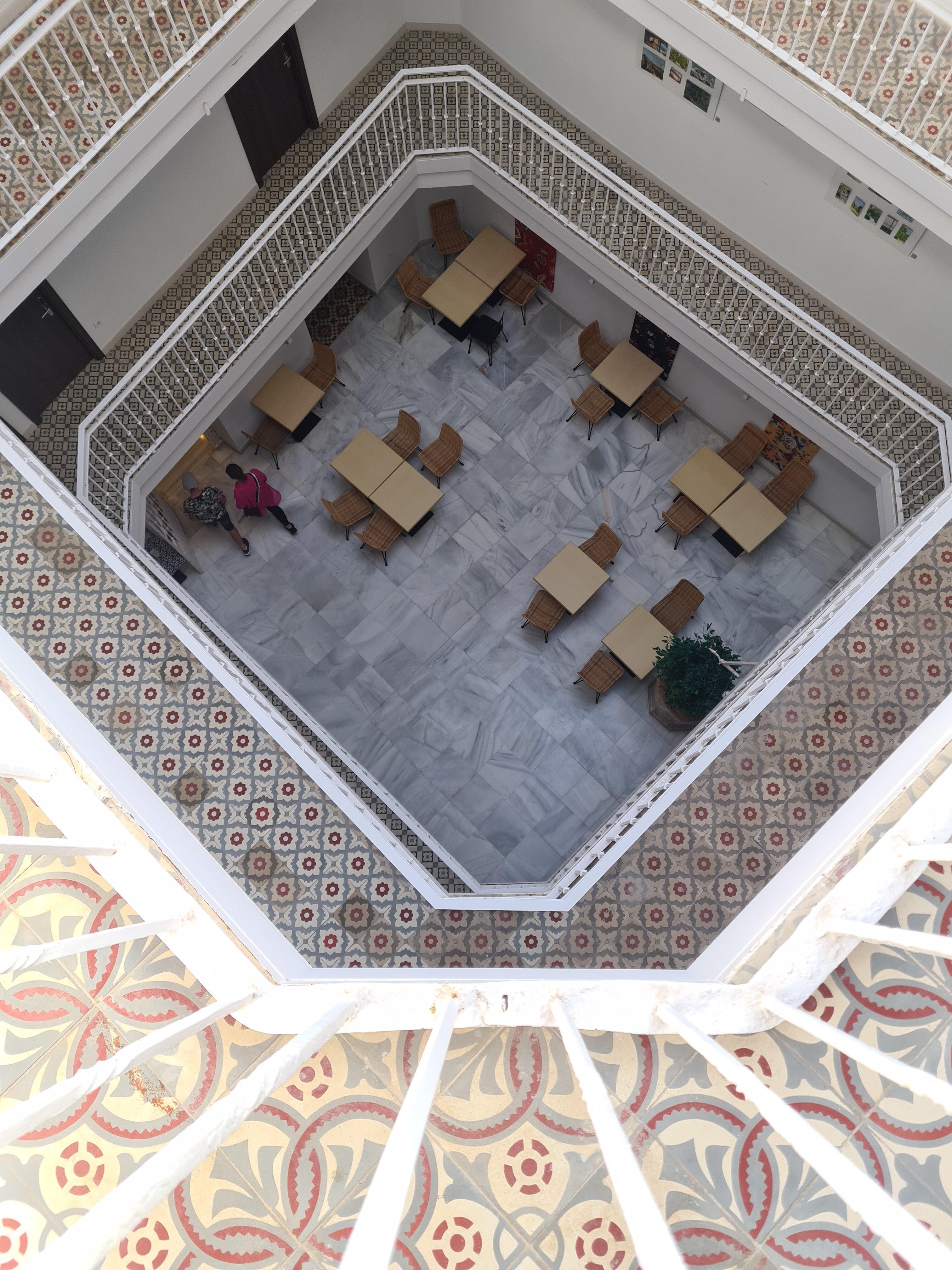 The court yard buzzes during breakfast