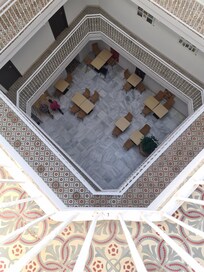 The court yard buzzes during breakfast