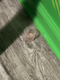 Used medicine cup found in kids room