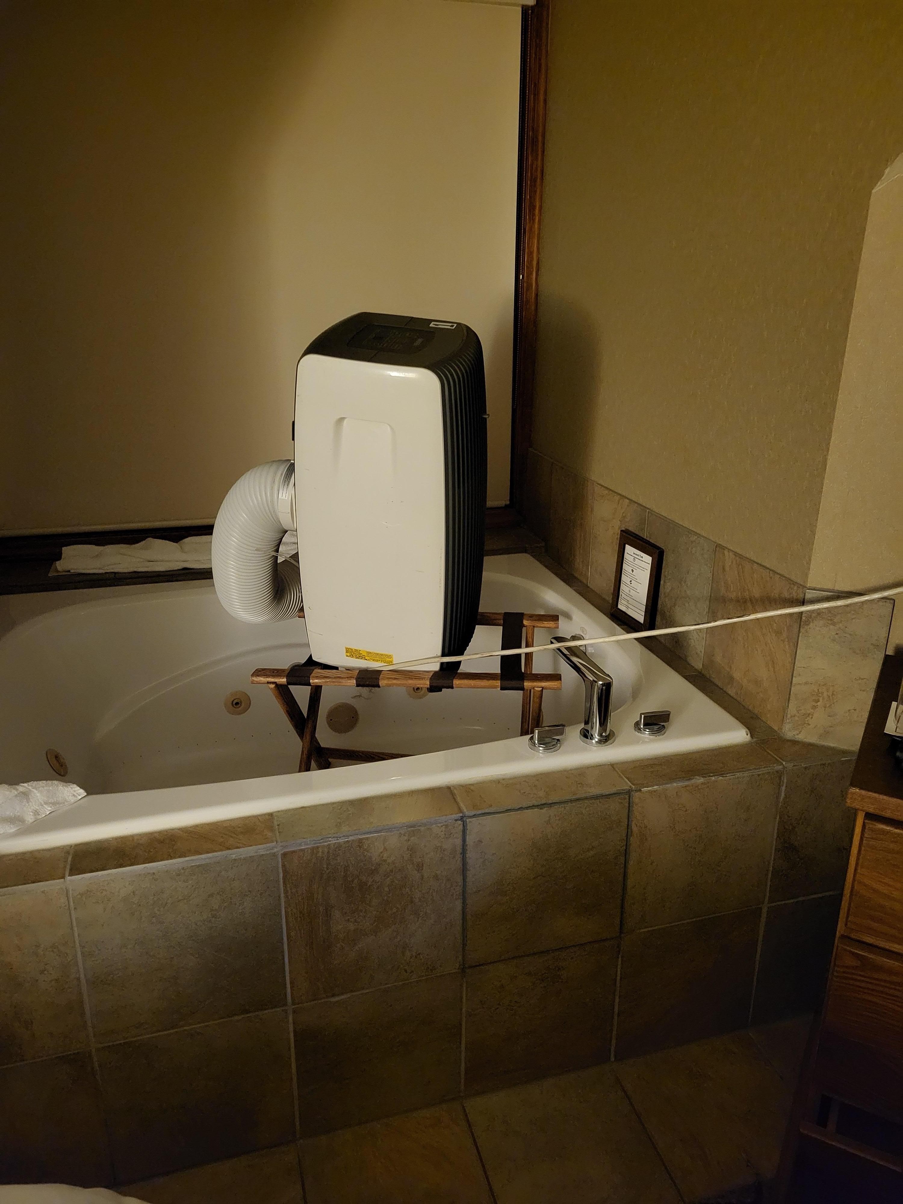 Portable A/C unit in the tub on the luggage rack because the upstairs was sweltering. Better not to be able to use the bathtub than to sweat all night. Also, they had a little fan on the dresser. They need to update the rooms and add ceiling fans.