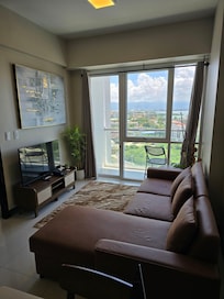 Living area w/ comfortable microfiber couch.