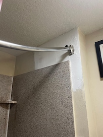 Shower rod holders were crumbling, so rod bowed down instead out out making the curtain hang only in the middle