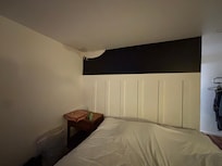 No wall decor- not sure what is going on with the ceiling, possible leak repair?