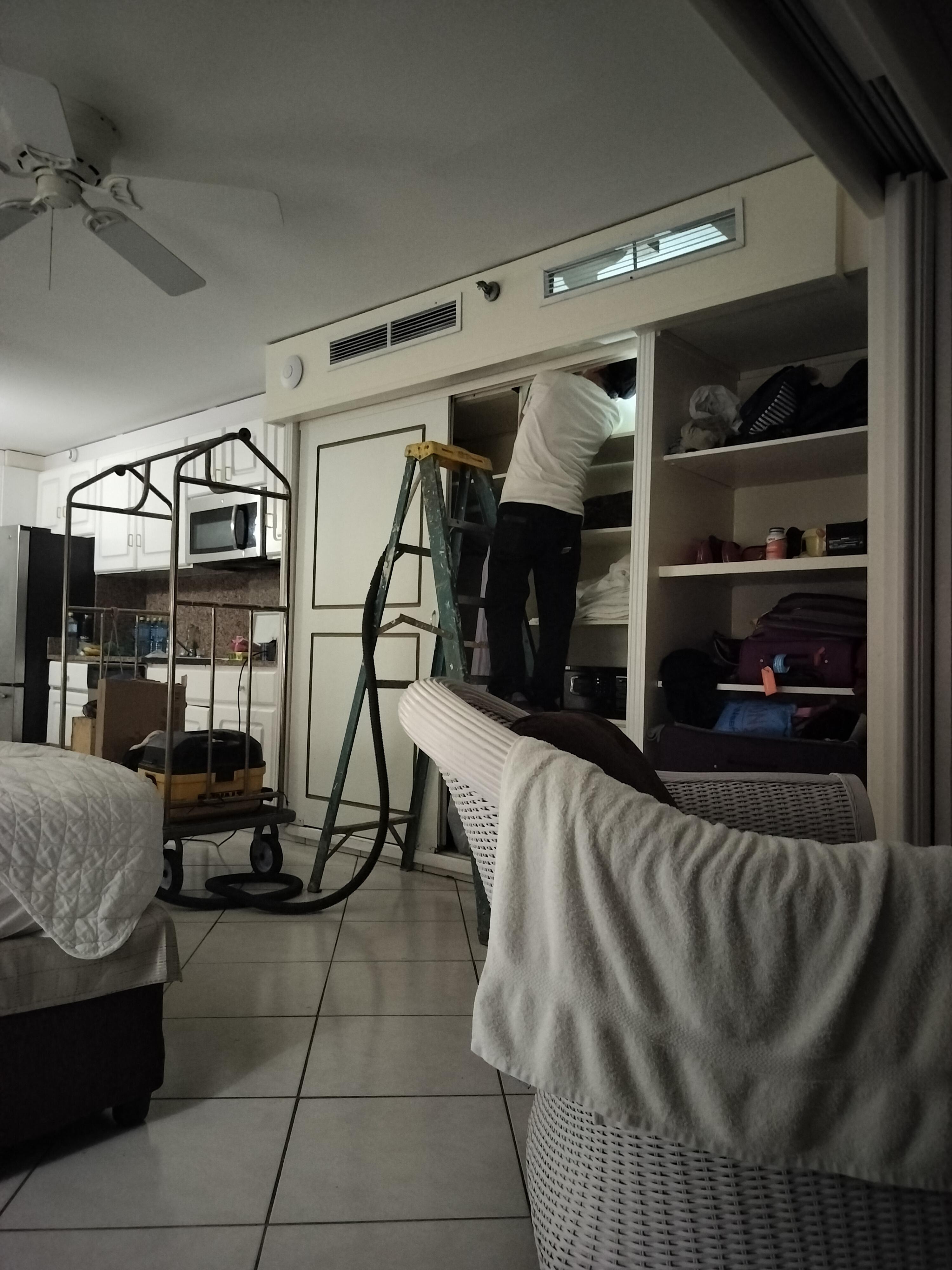 Fixing the leaking AC in the room. Took over an hour to fix