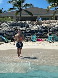 Beach in front of house