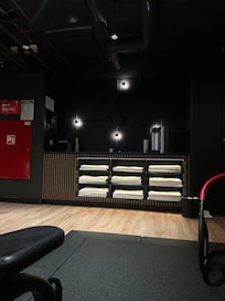 The gym has clean towels and a water dispenser.