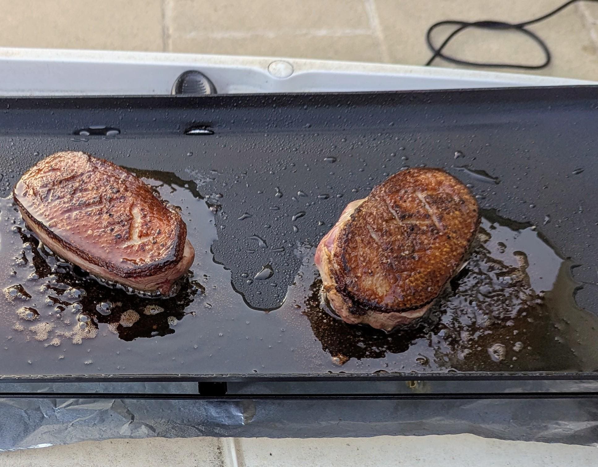 Grilling duck breasts on the patio using a the electric "Planche"