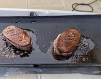 Grilling duck breasts on the patio using a the electric "Planche"