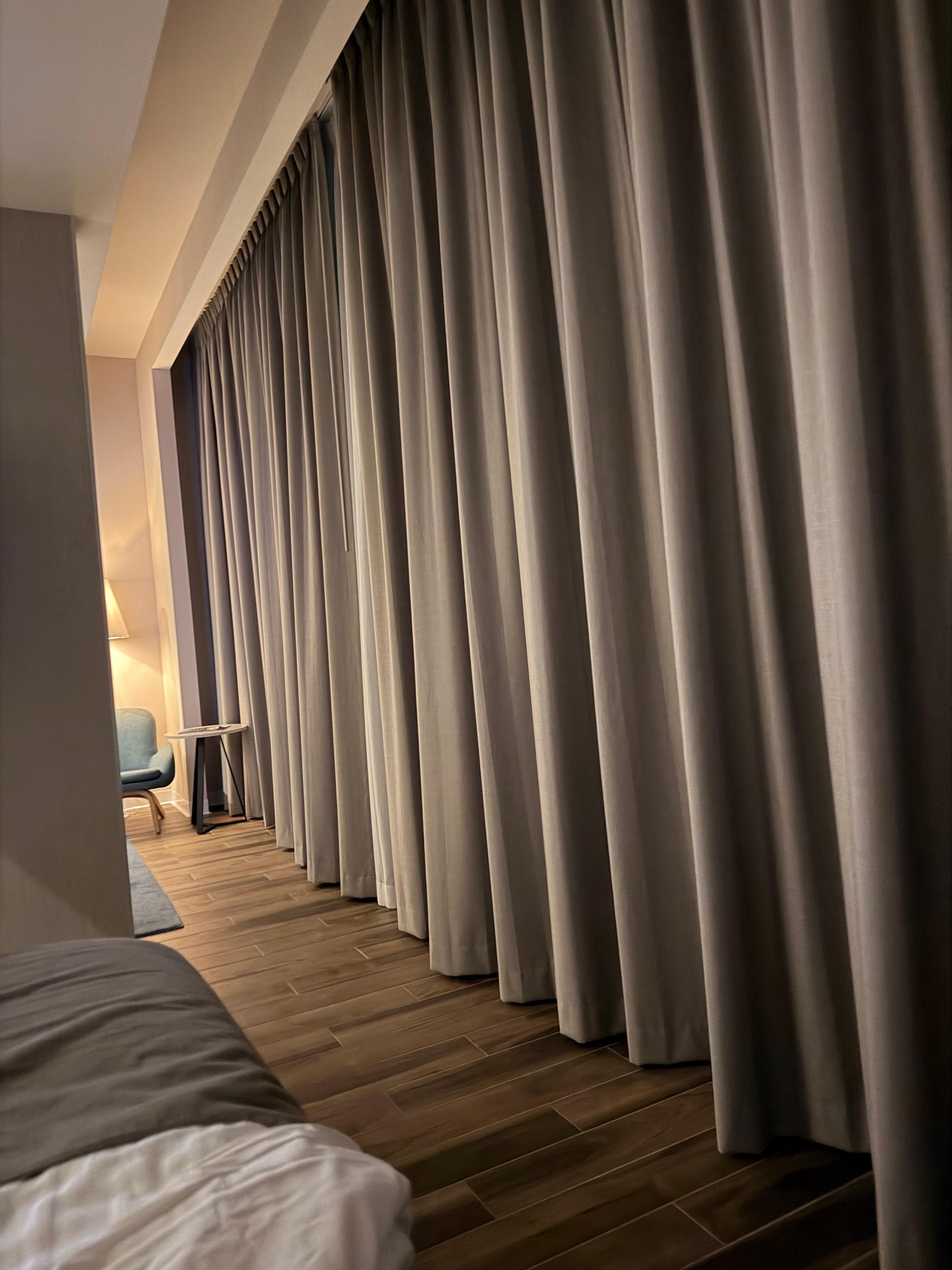 When the drapes are open, that will be a city view from the bed