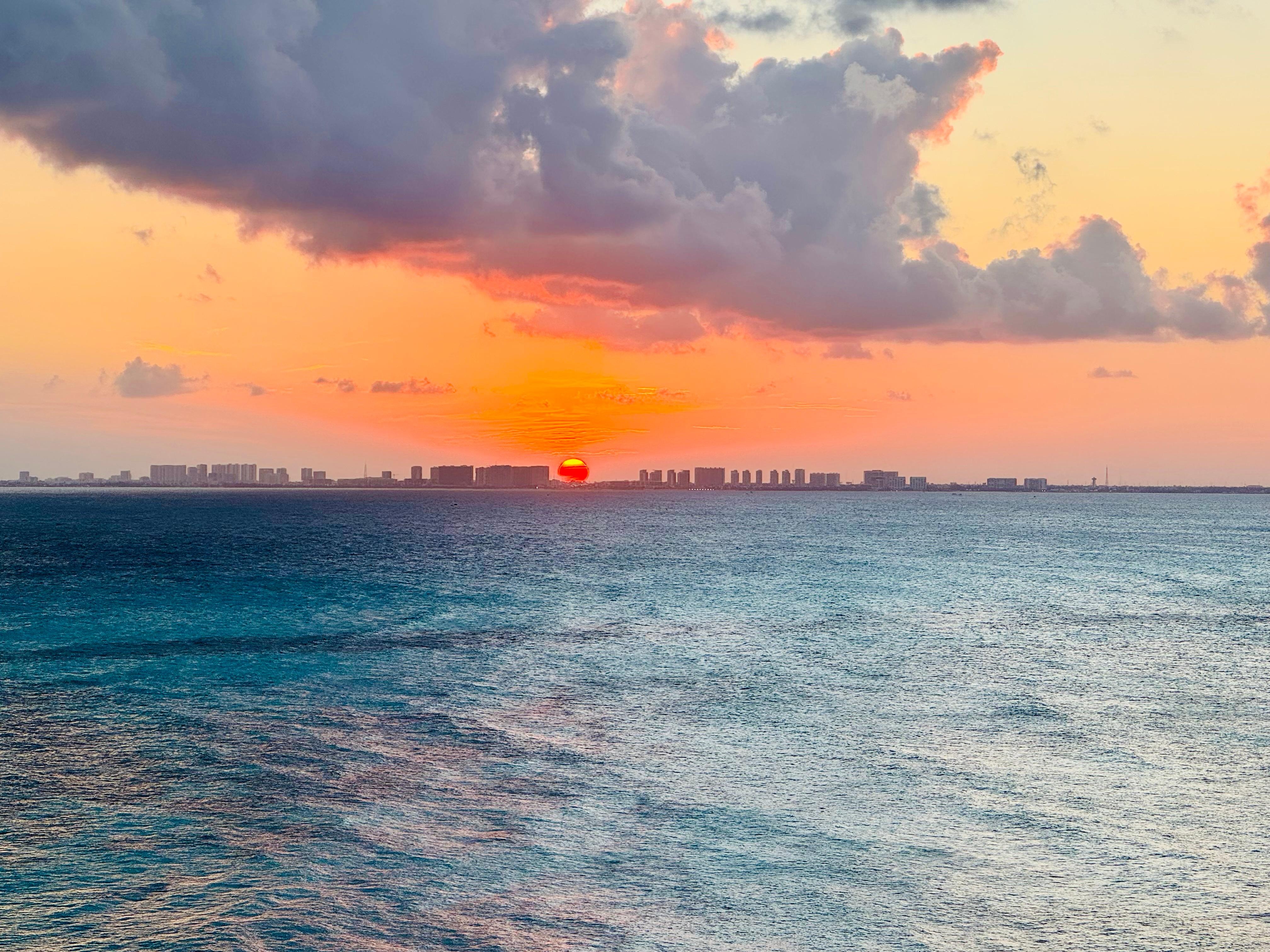 Took this from the balcony at sunset, we could see fireworks in Cancun at night while we had dinner outside 