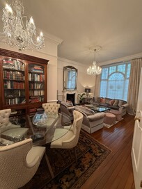 Sitting room with beautiful chandeliers.
