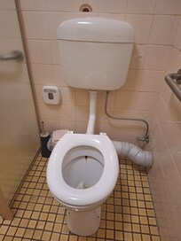 Filthy flooded floor in bathroom.