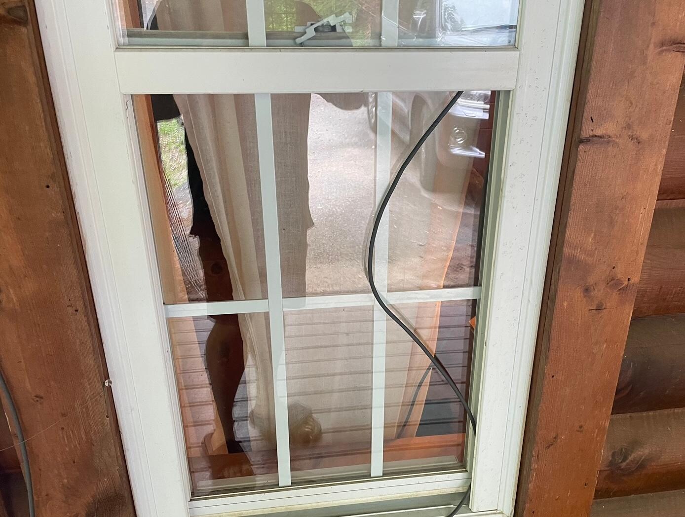 Wire going through master bedroom window with broken lock
