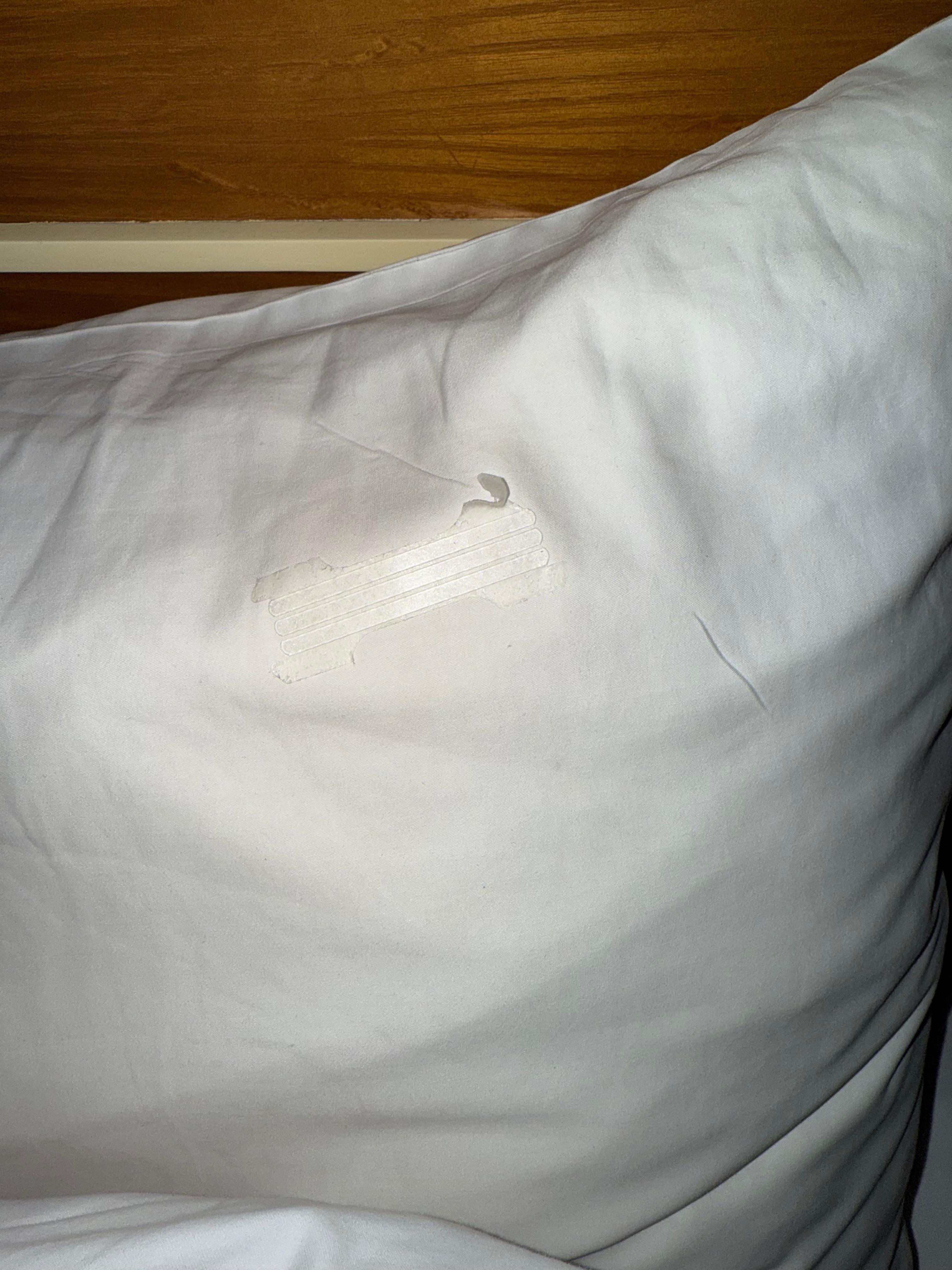 Someone’s used nose strip in the pillow.