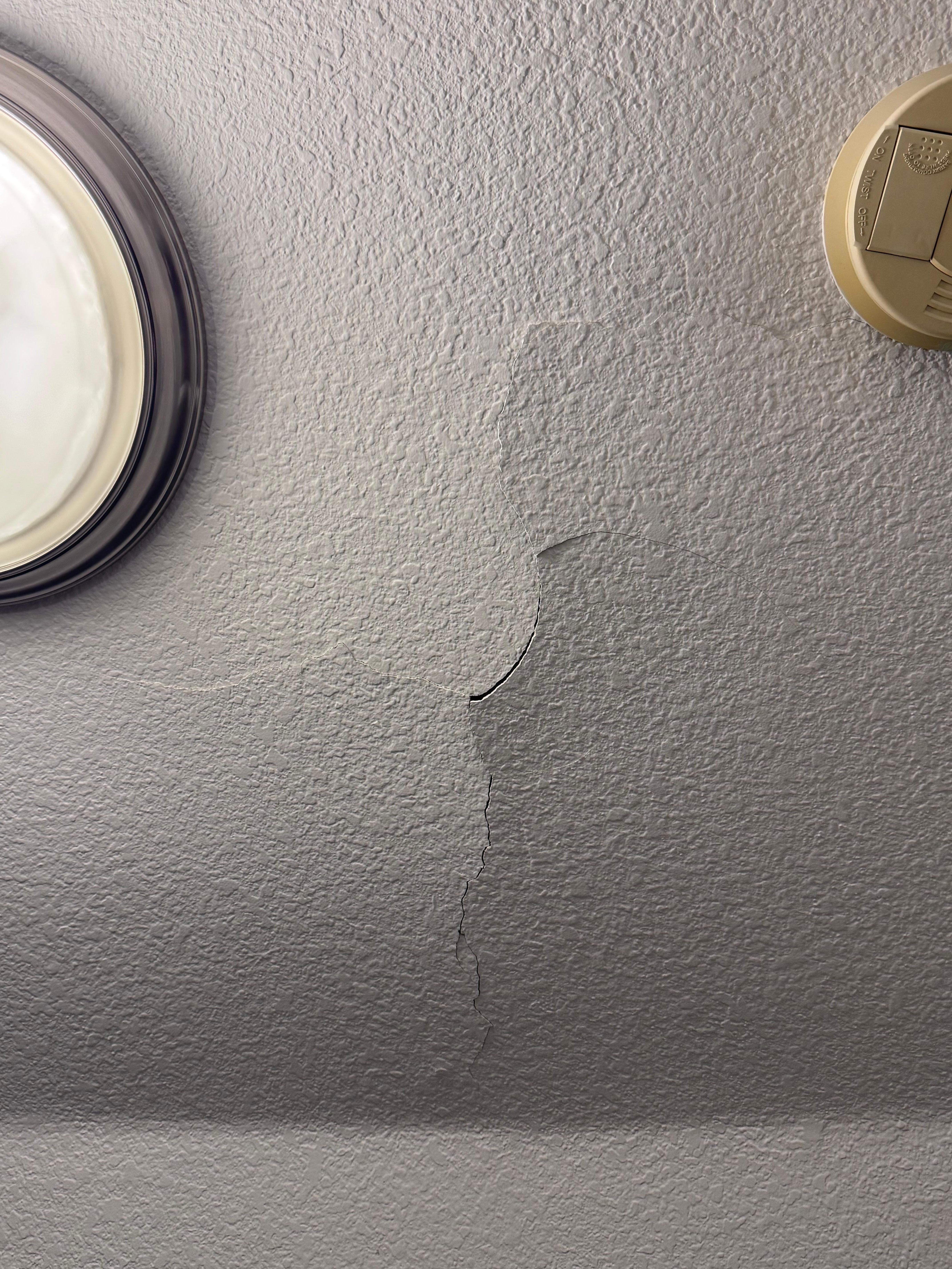 Cracked ceiling in one of the upstairs bedrooms.