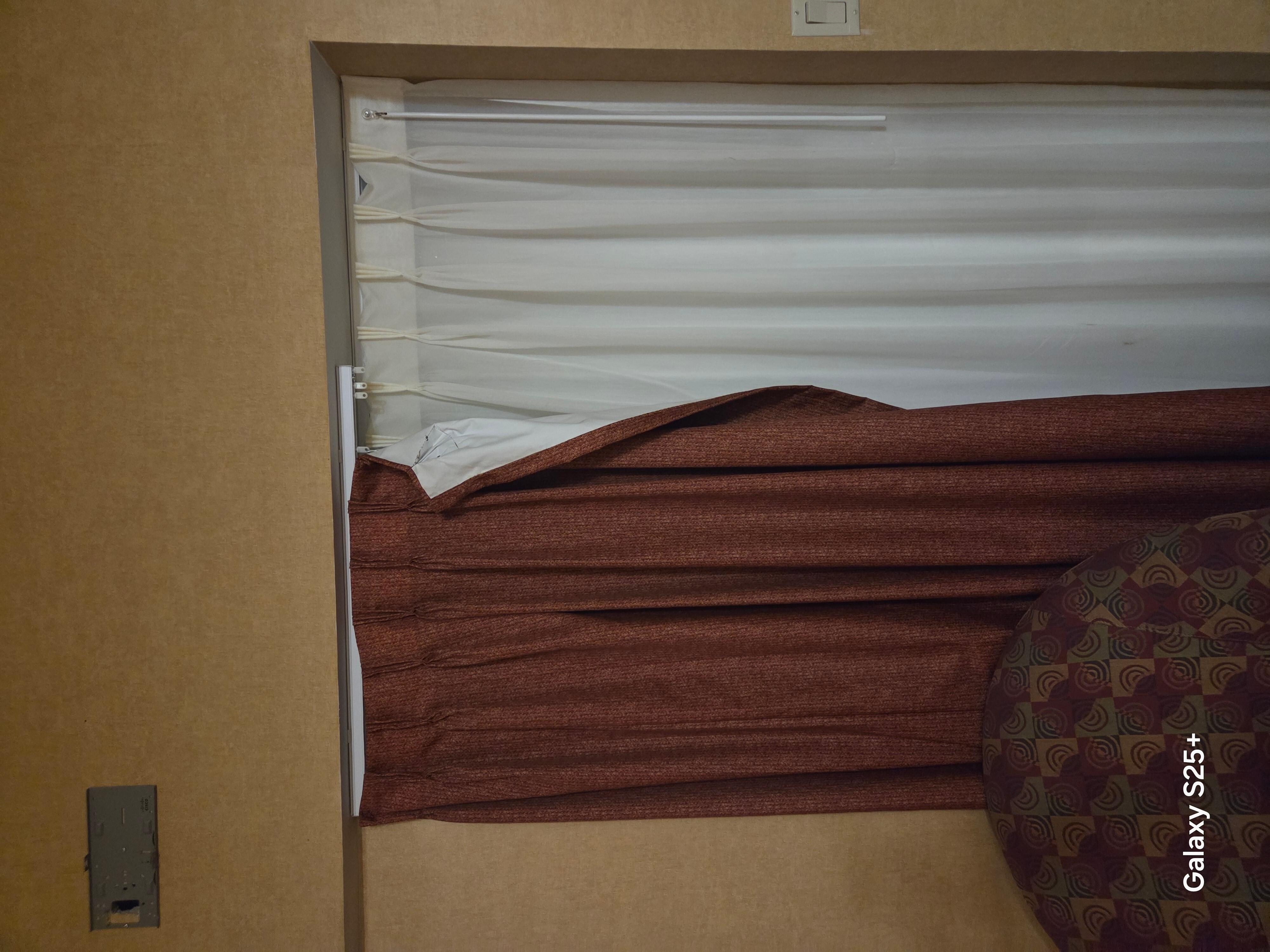 Torn and stained curtains 