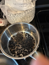 Pot was in drawer. Looks like burnt beans. We cleaned it the best we could.
