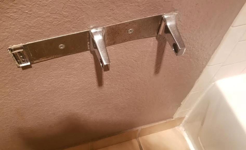 broken toilet tissue holder