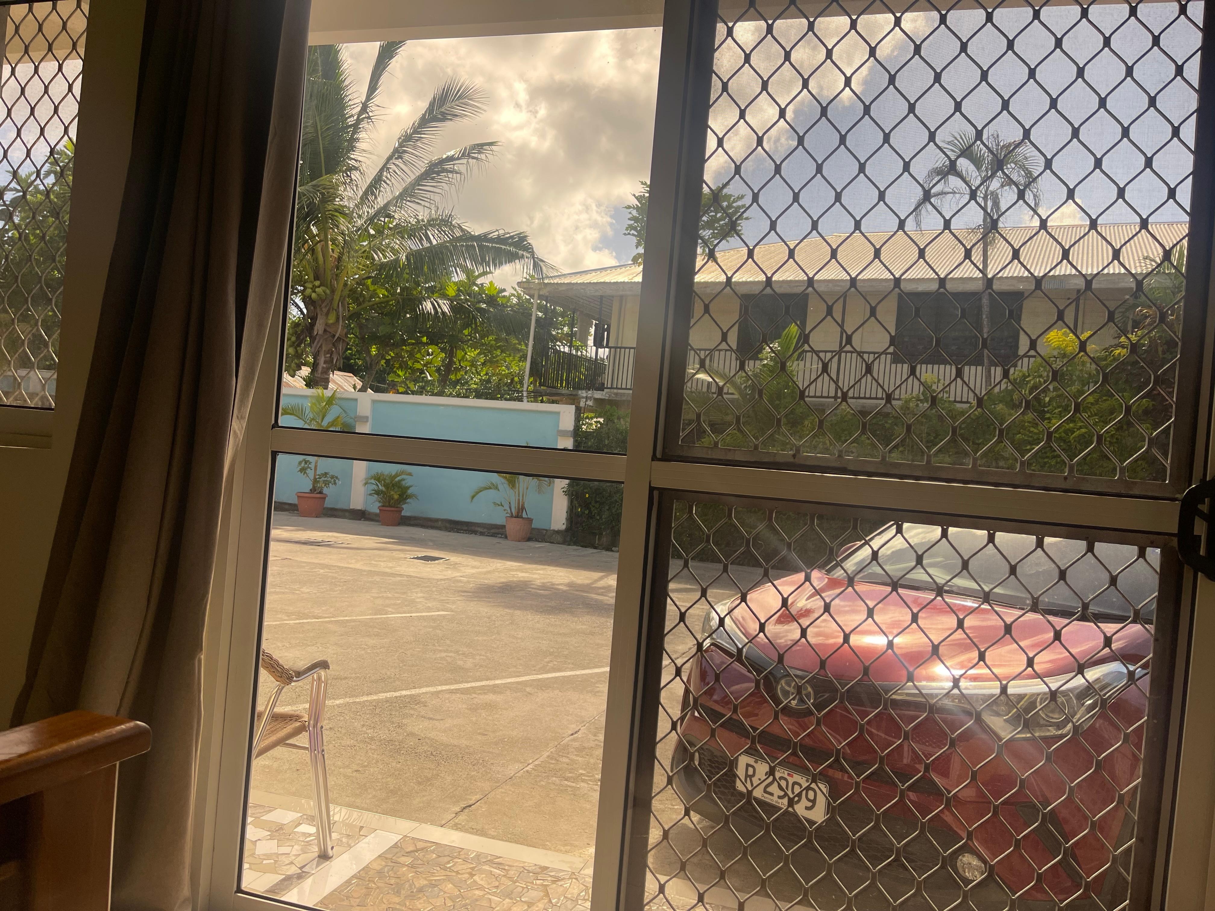 The front of our hotel room #4 including my rental car from Samoana 