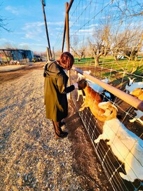 Me feeding the goats