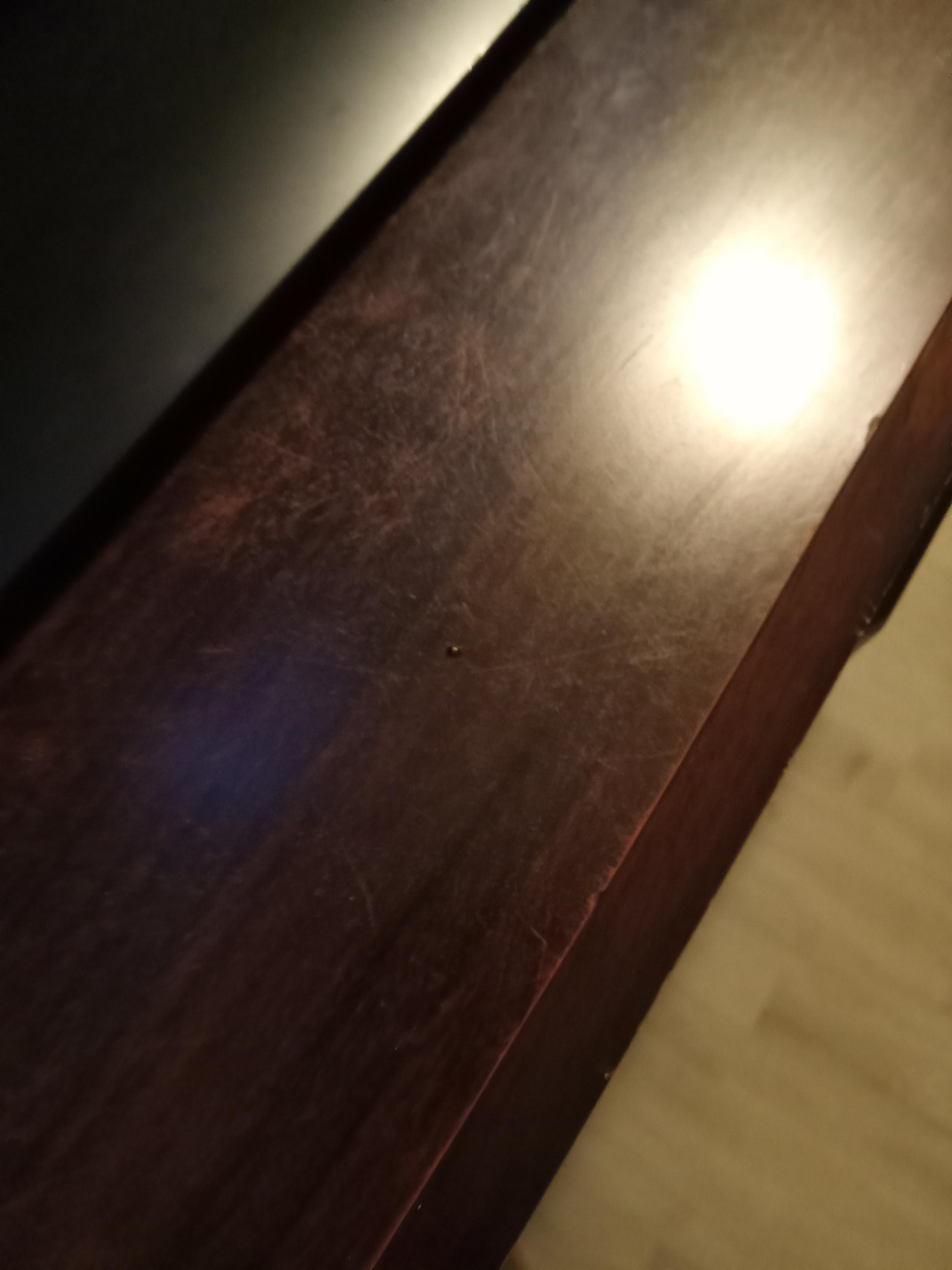 baby roach crawling on tv dresser