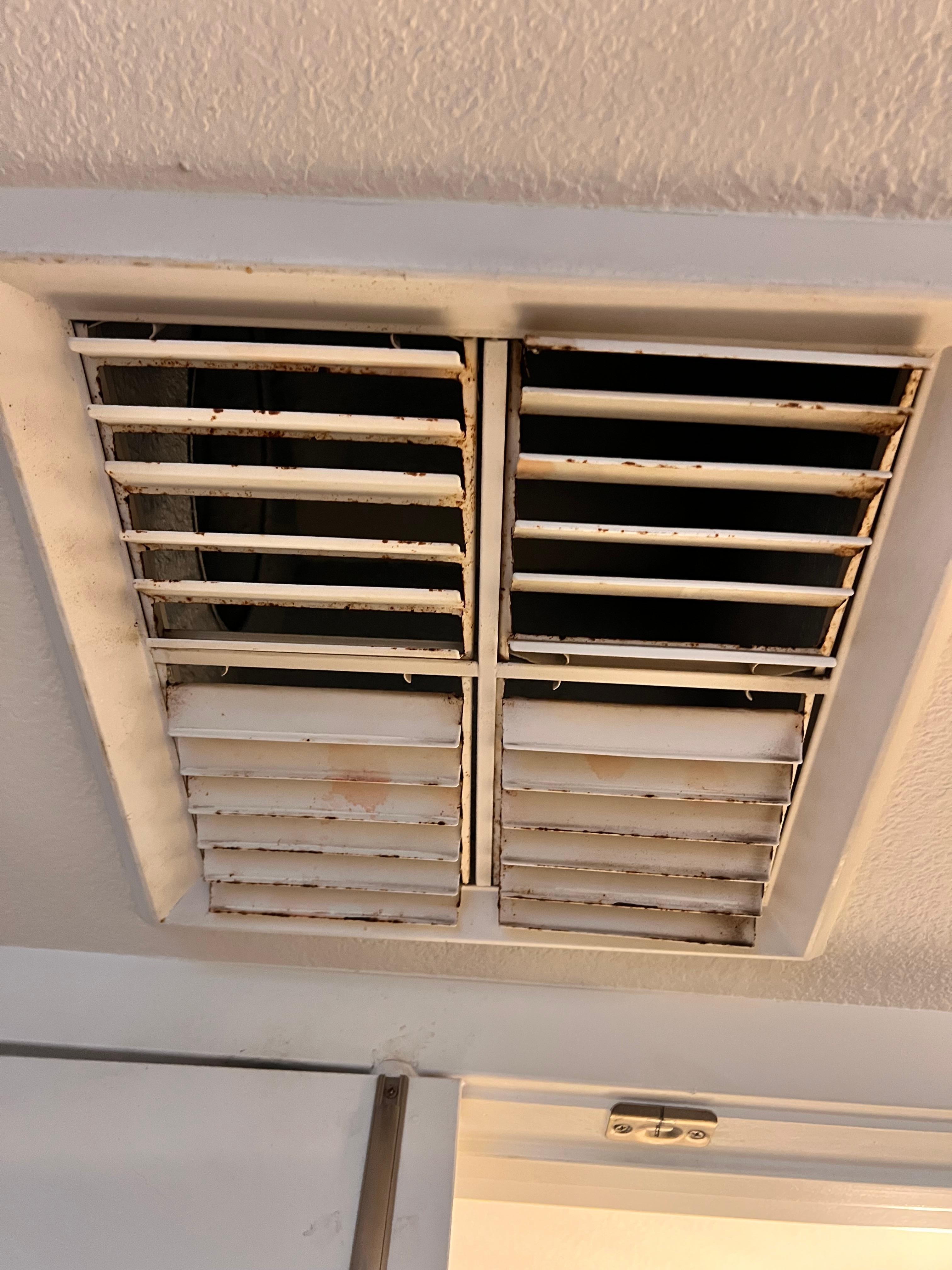 Vent in ceiling in bedroom was old and rusted. 
