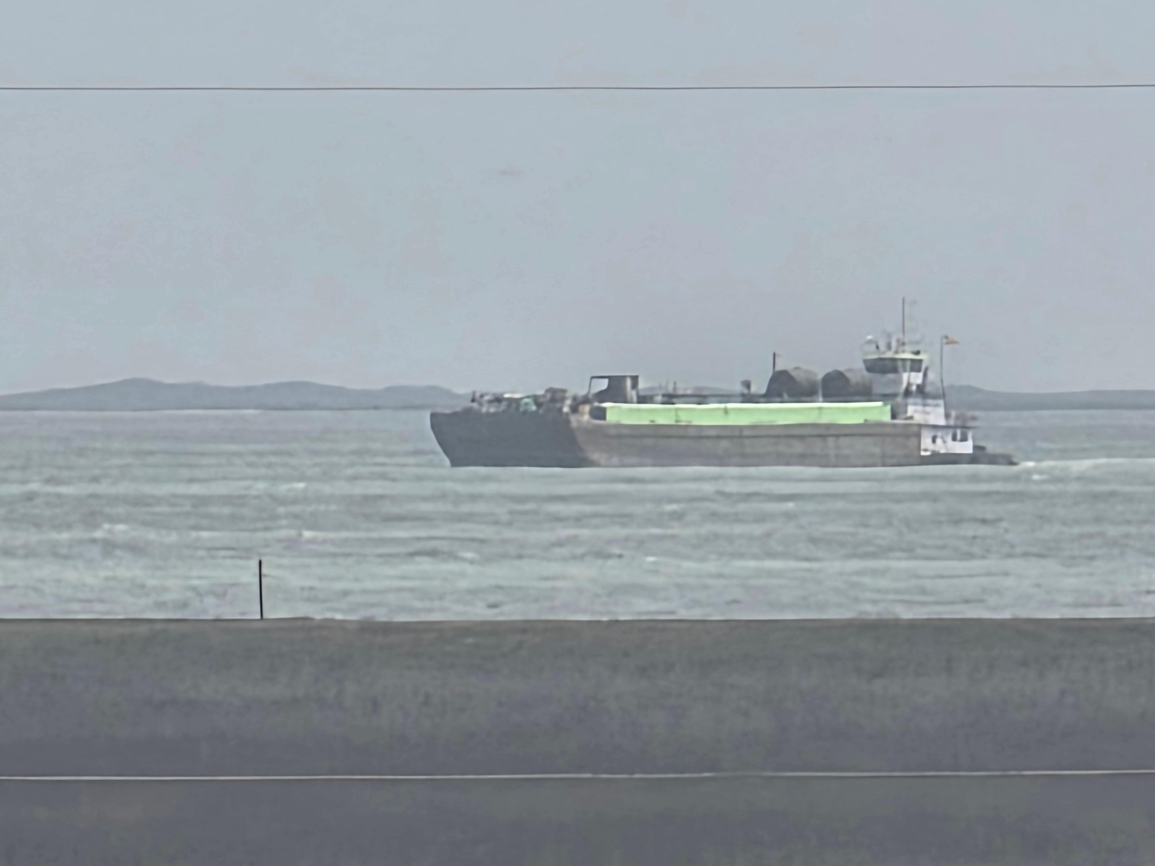 Barge and Tug on the ICW as seen from the front porch/deck