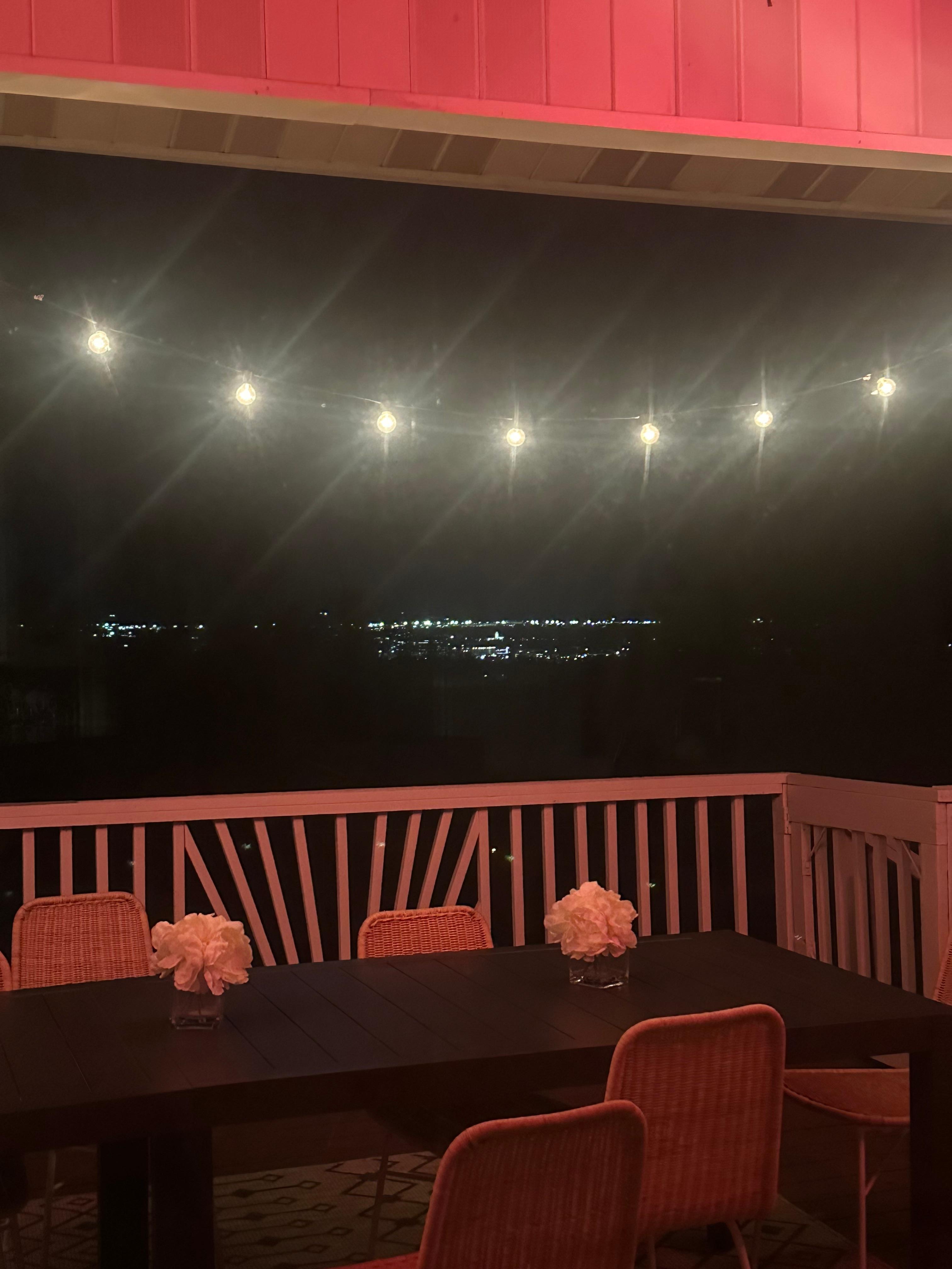 Dining patio view of Boise at night 