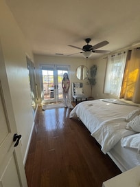 The upstairs bedroom with queen and access to balcony with propane fire pit (didn't work)