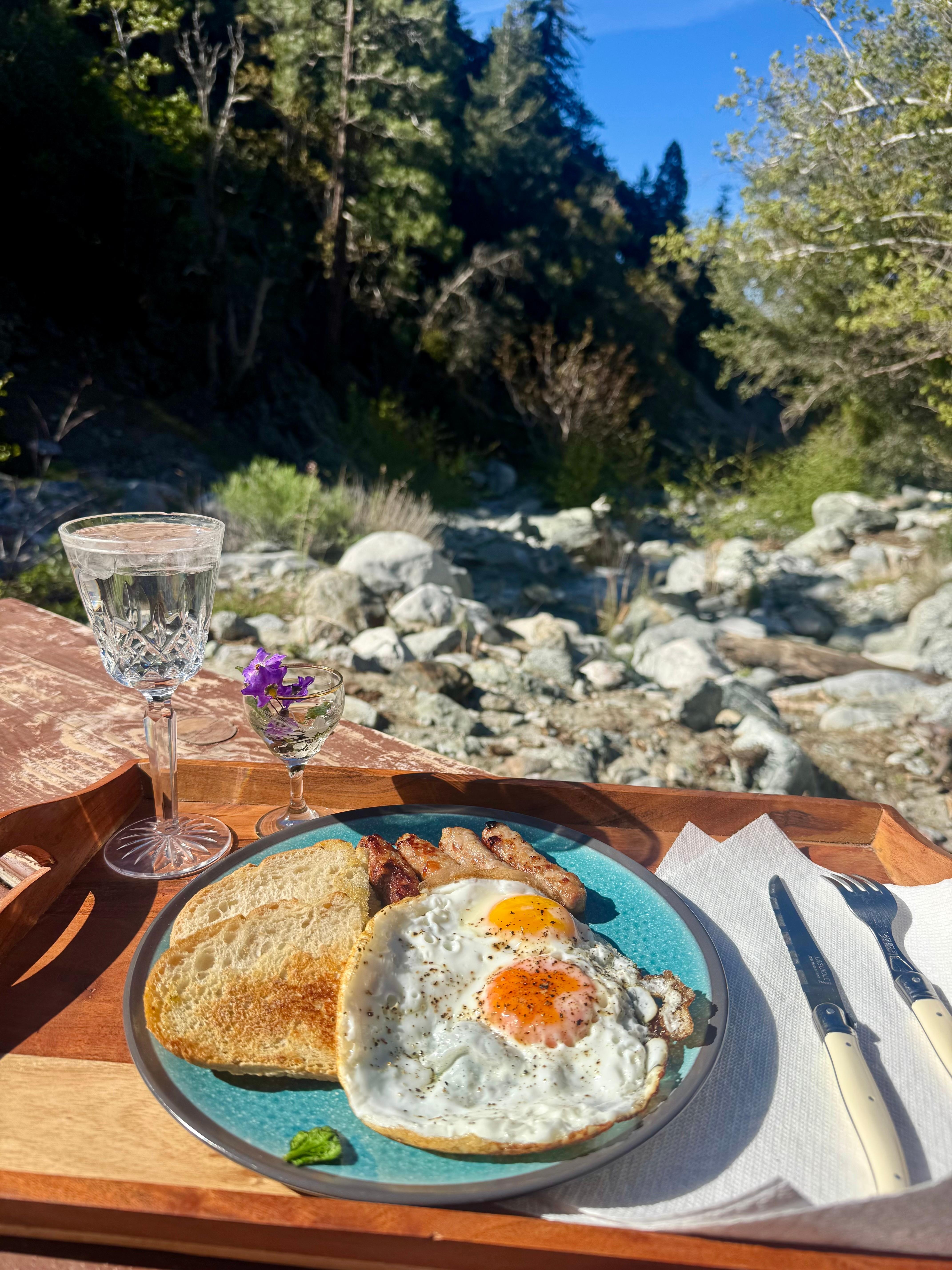 Breakfast on a platform surrounded by water.
