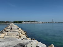 walking the breakwater, looking back at Inn and Ptown Harbor