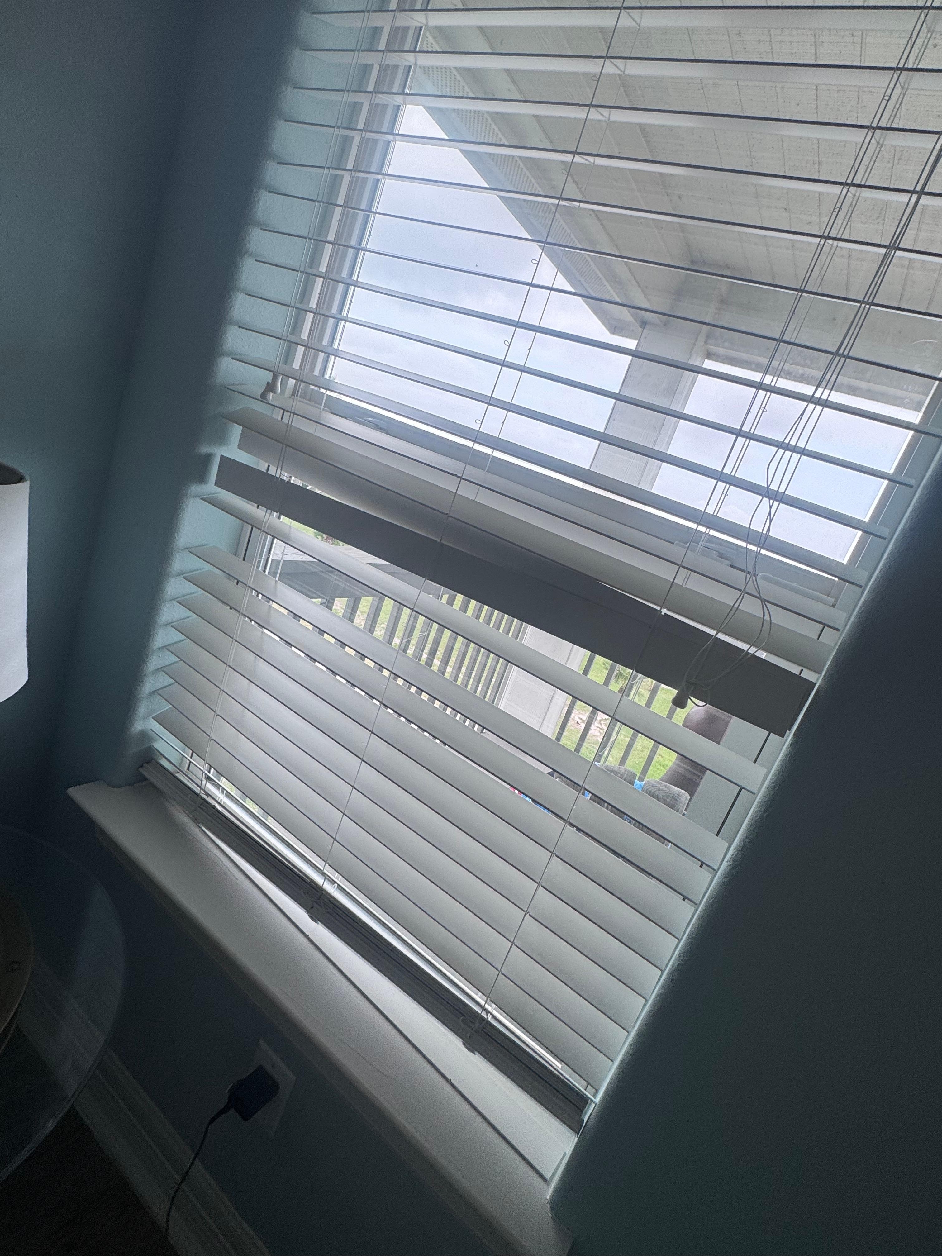 Broken blinds in upstairs bedroom