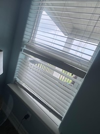 Broken blinds in upstairs bedroom